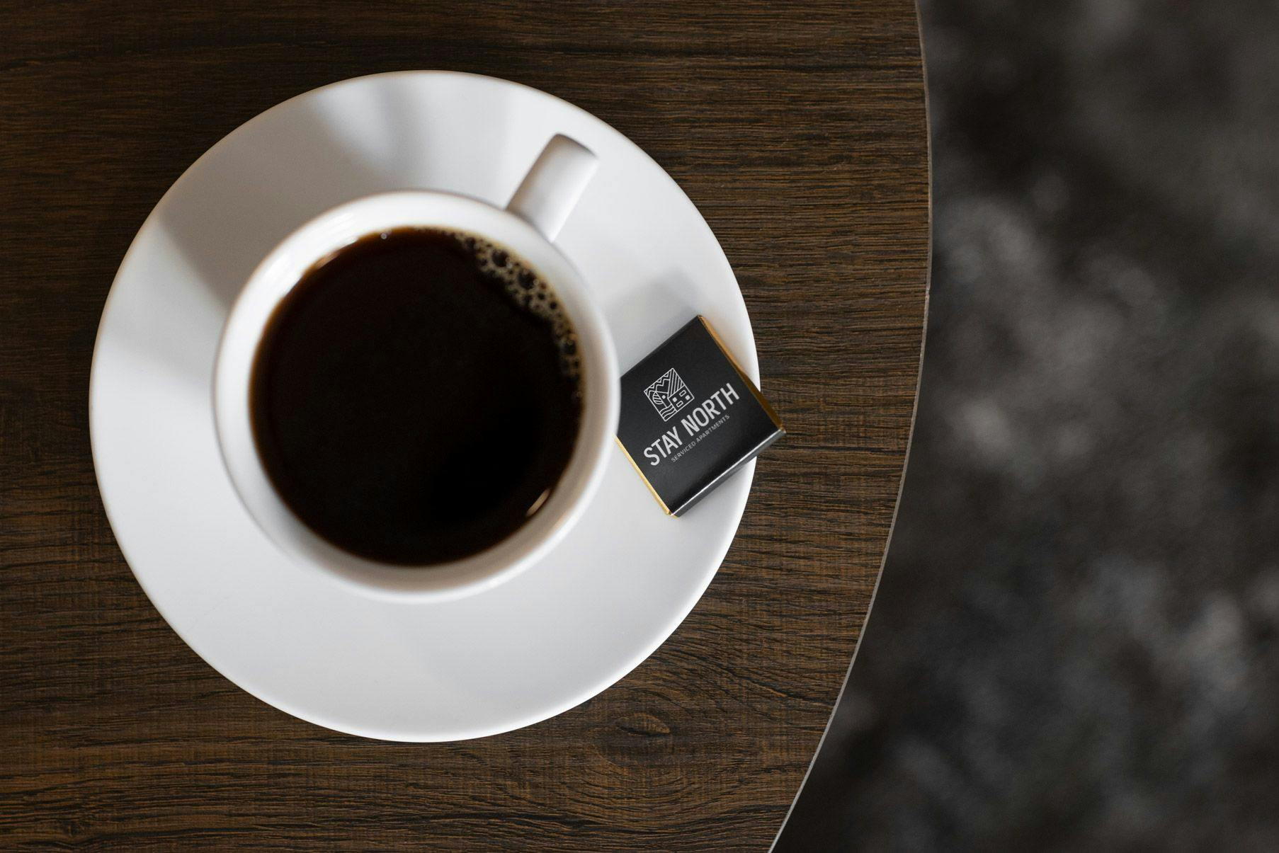 Photo: A cup of coffee with Stay North chocolate.
