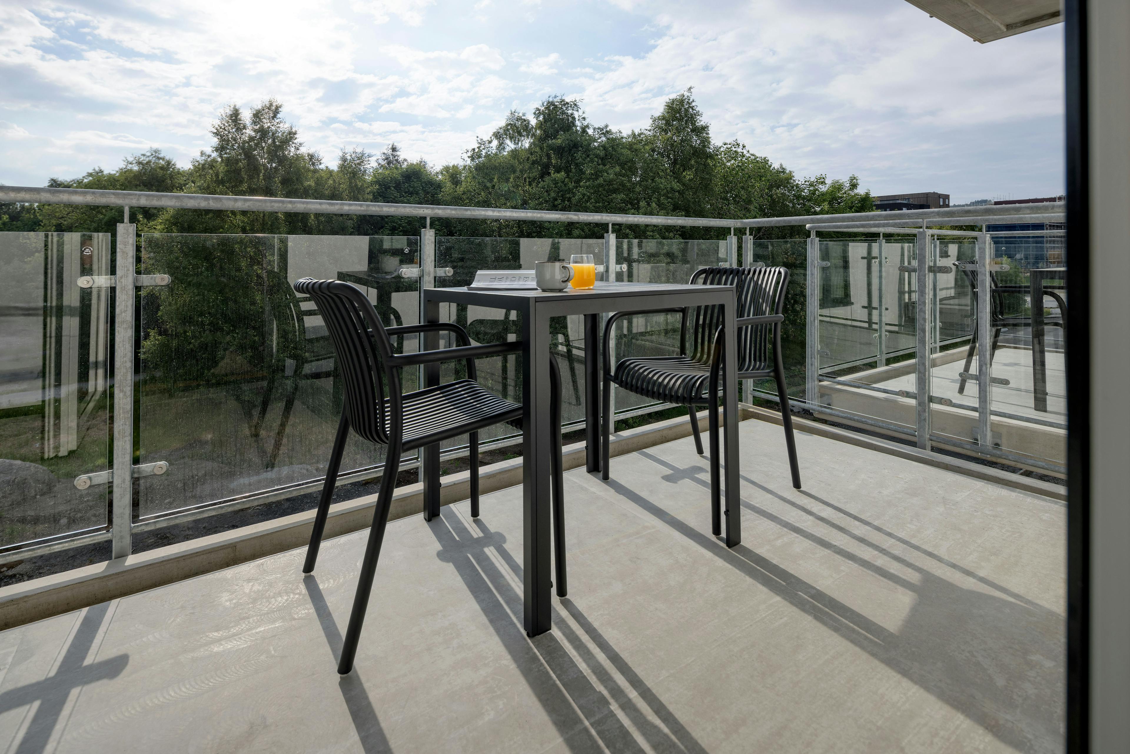 Photo: Balcony of standard two-bedroom apartment at Hinna location.